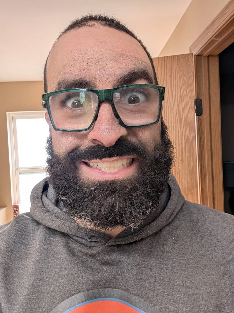 Close selfie, eyes wide, eyebrows up, filling the whole frame.